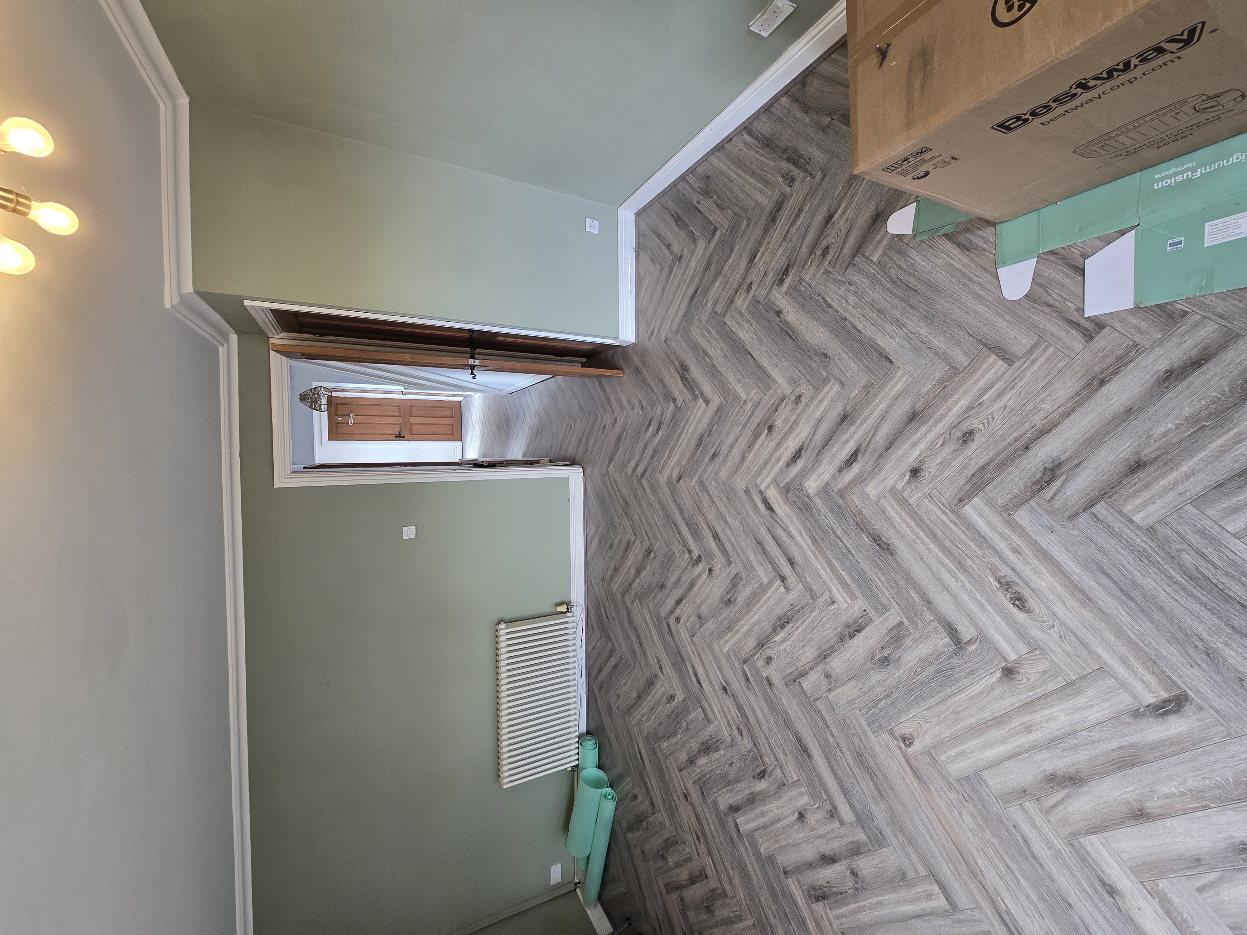 Herringbone laminate flooring installation, South Wales